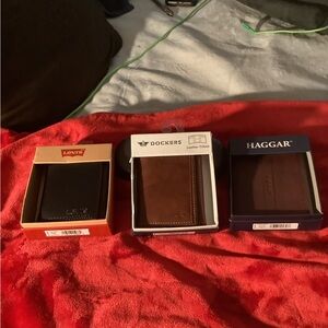Men’s Haggar brown, Dockers, Levi’s black leather wallet.